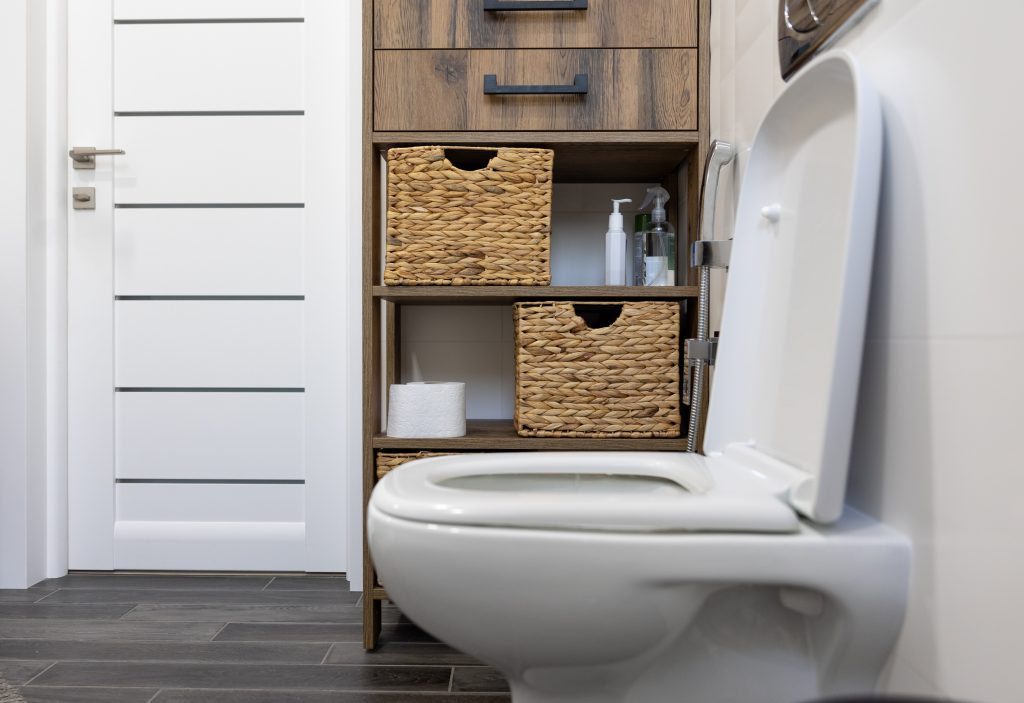 How can I hide my toilet in a small bathroom?