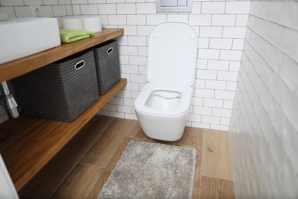Where should a toilet be placed in a small bathroom